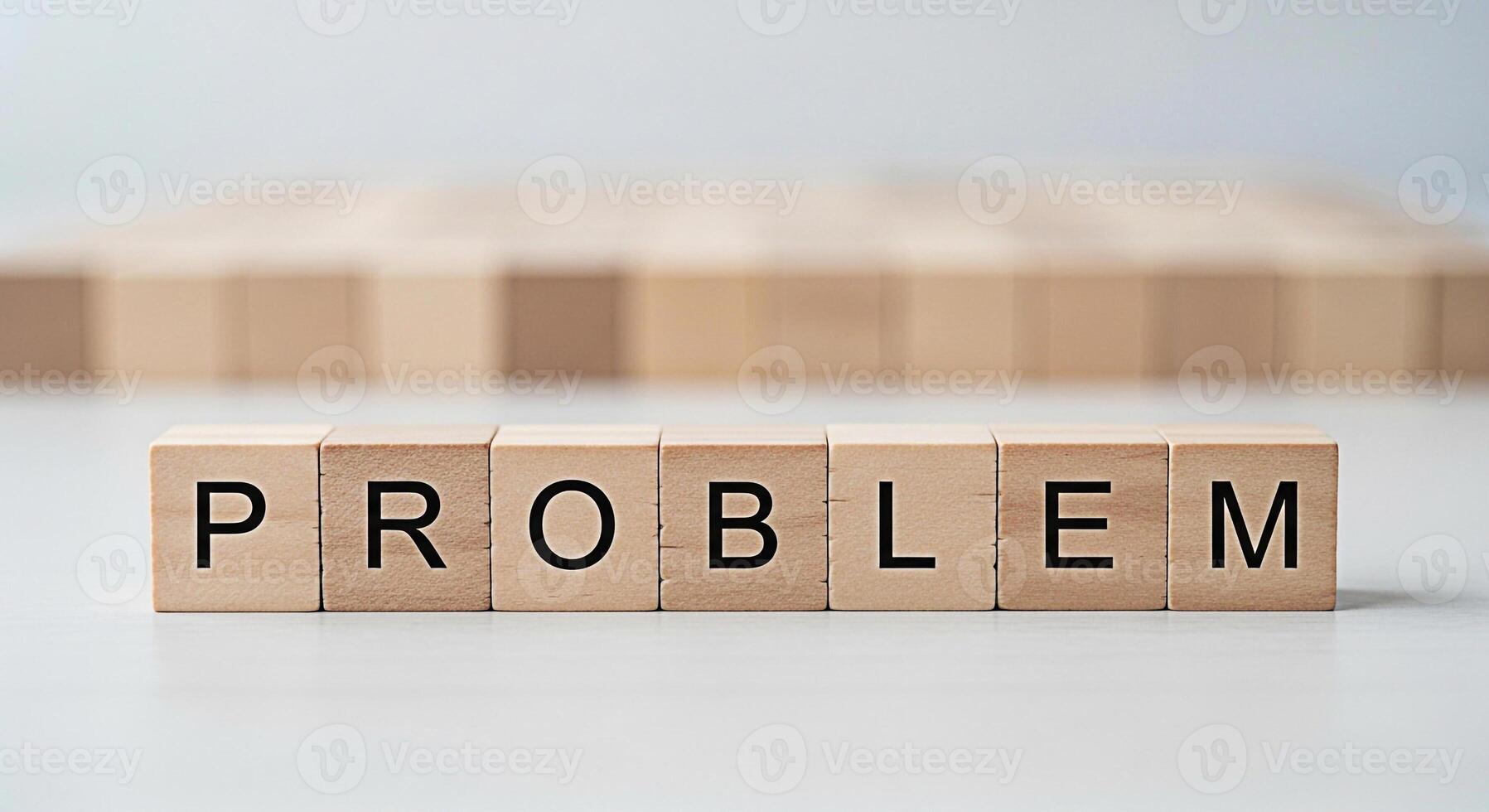 Wooden blocks spelling PROBLEM on a white surface representing challenges and difficulties in a clean minimalist setting conveying a sense of analysis and solutionseeking photo