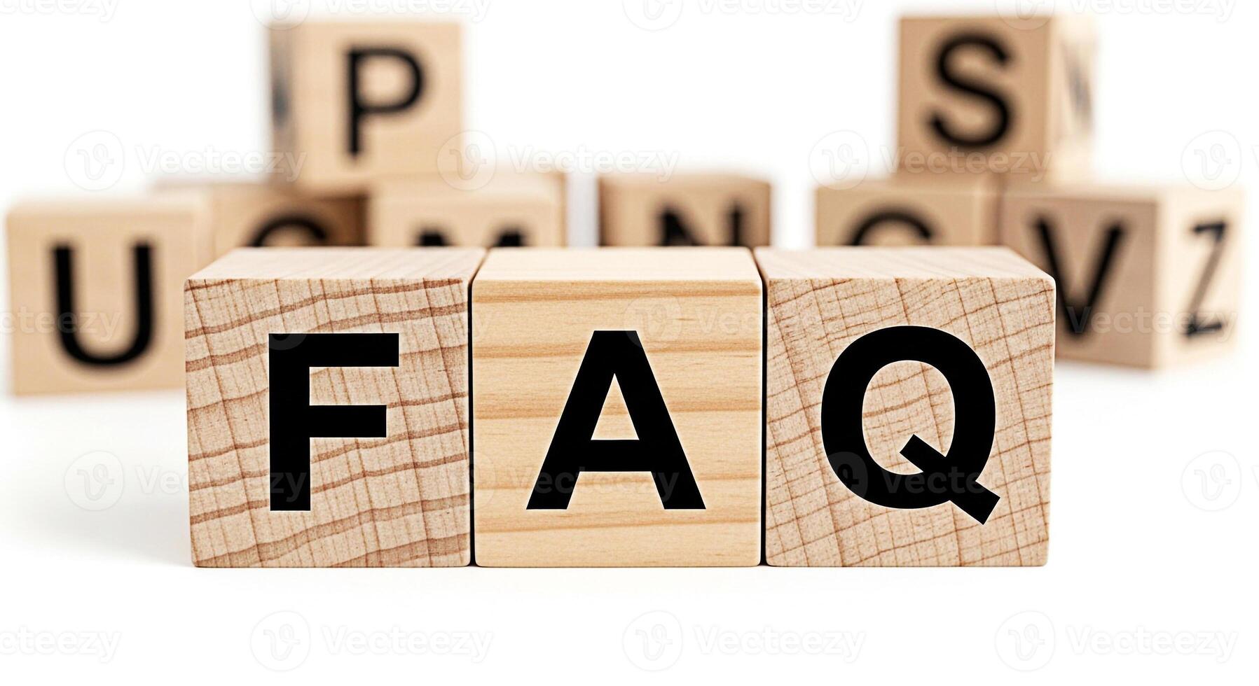 Wooden blocks spelling FAQ on a white surface representing frequently asked questions and information resources creating a clear and accessible knowledge base for users seeking answers and support photo