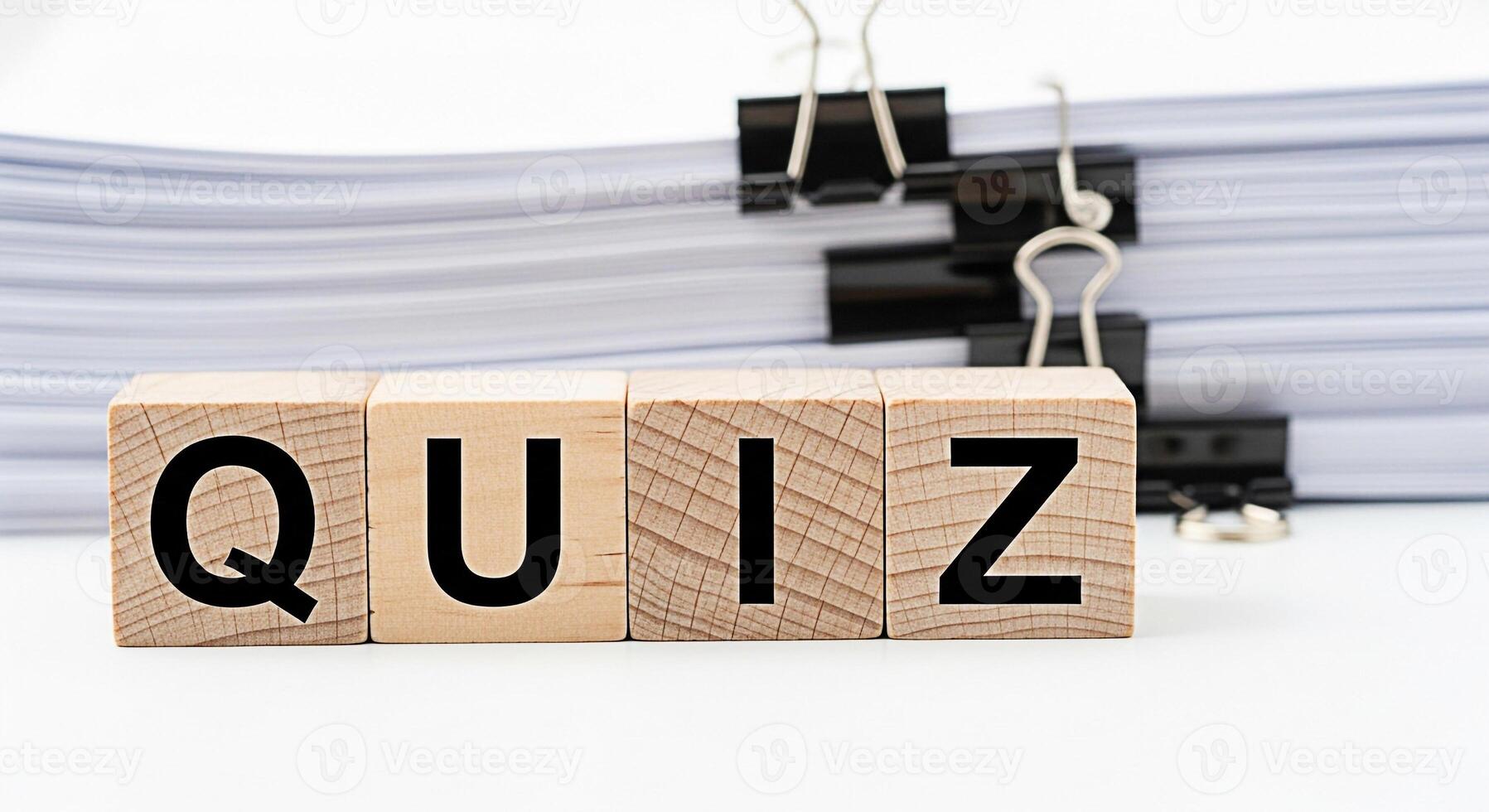Wooden blocks spelling QUIZ in a bright organized office environment representing knowledge assessment and learning suggesting a fun and engaging educational experience with a focus on testing skills photo