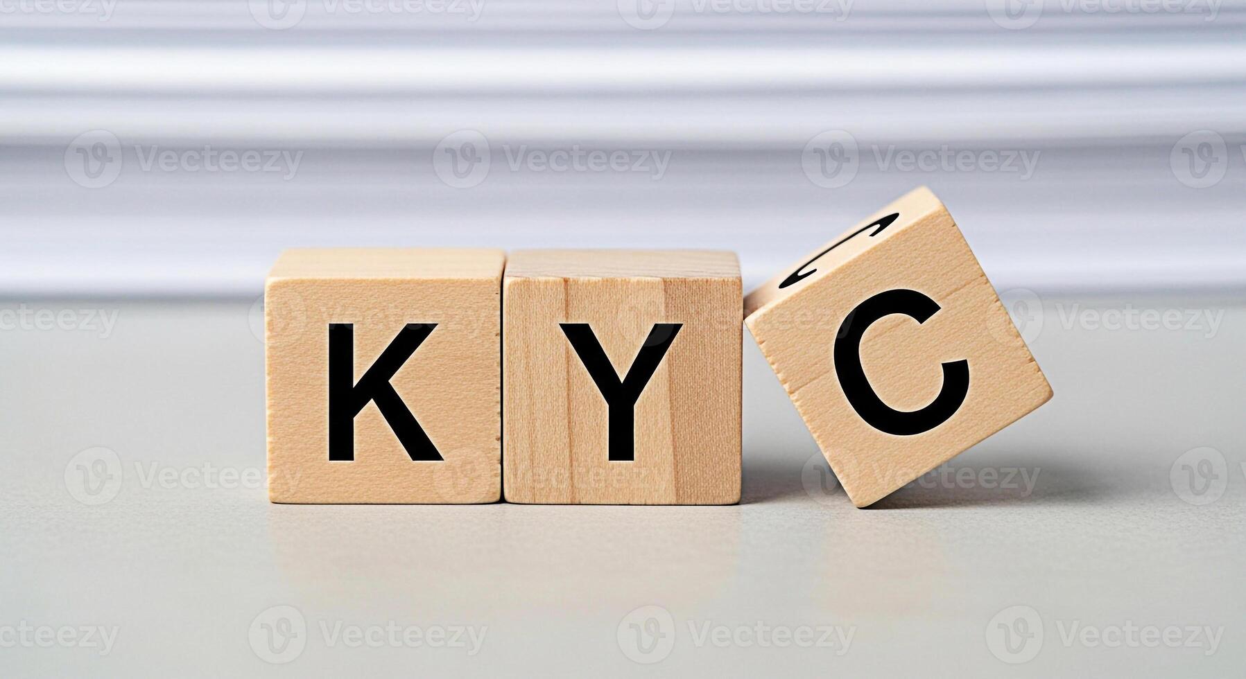 Wooden blocks spelling KYC on a neutral surface symbolizing compliance and identity verification in a financial or business setting conveying trust and regulatory adherence photo