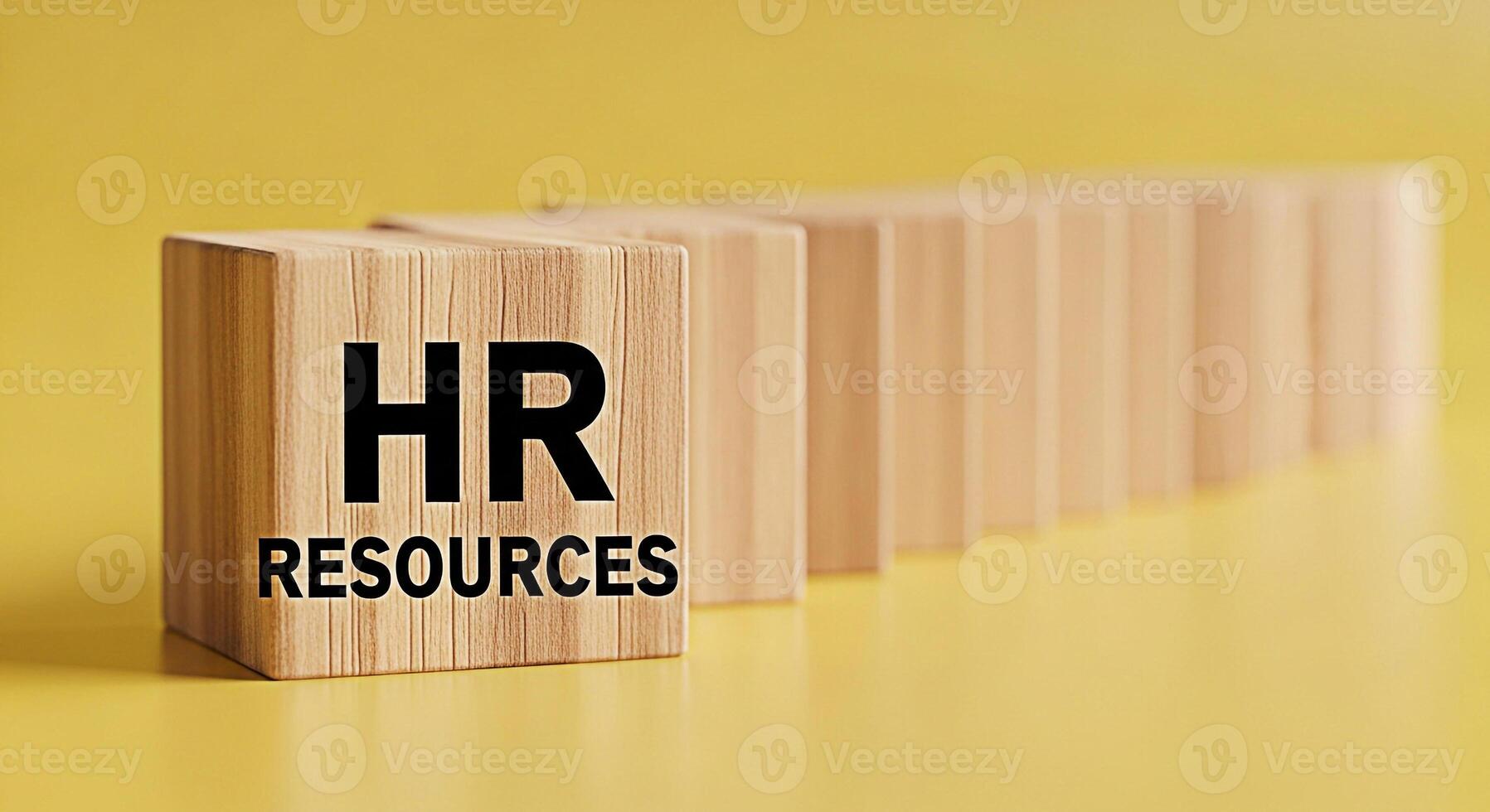 Wooden blocks displaying HR Resources on a yellow background representing human resources management and organizational structure conveying a message of support guidance and strategic planning for bus photo