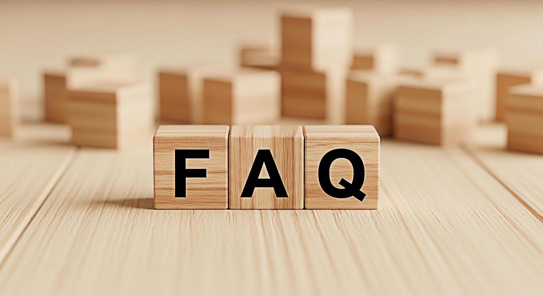 Wooden blocks displaying FAQ on a light wooden surface representing frequently asked questions and information creating a helpful and informative atmosphere for customer service and support resources photo