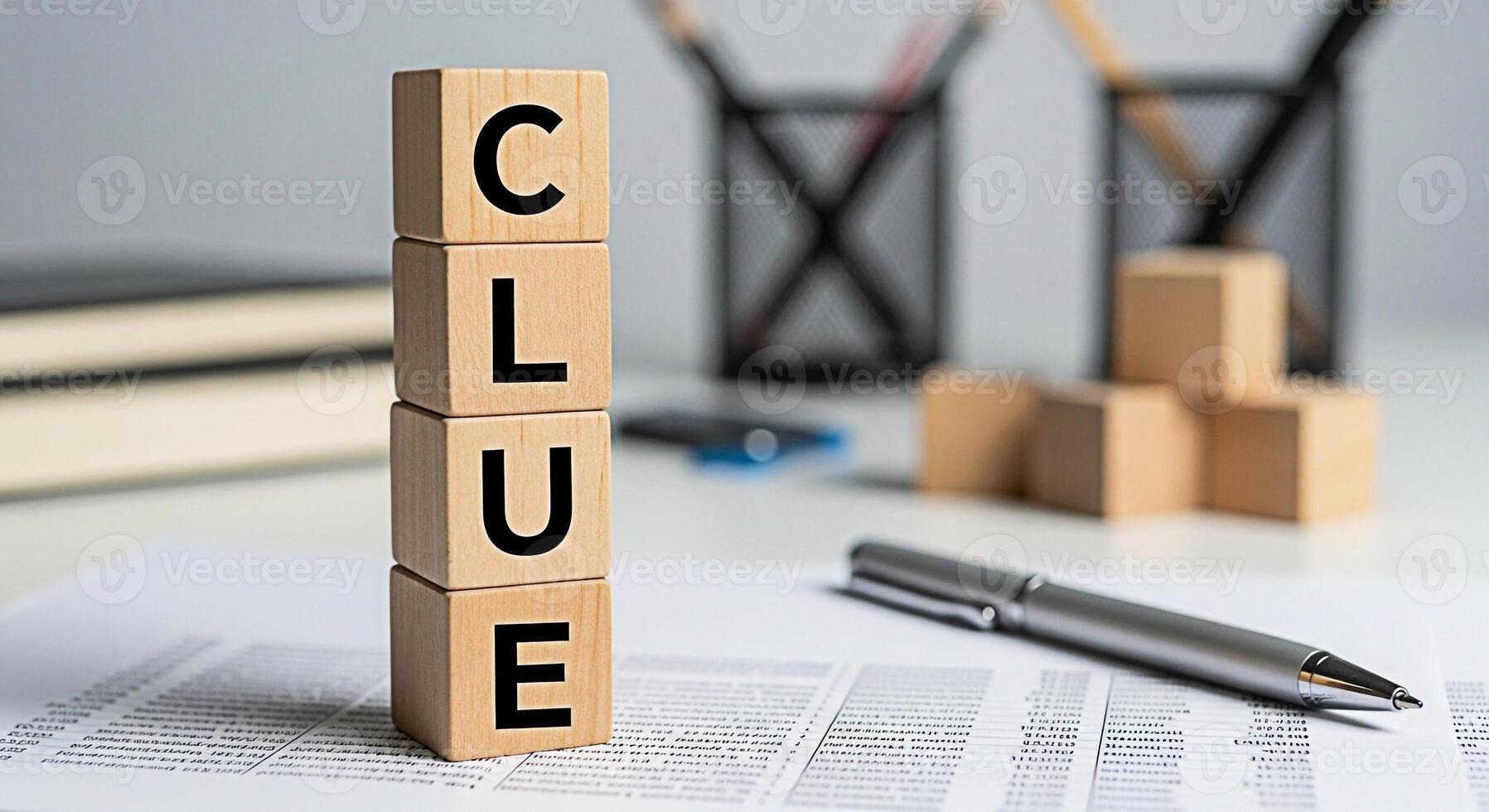 Wooden blocks spelling CLUE on a white desk with a pen and documents representing problemsolving and investigation in a professional and organized environment suggesting mystery and analytical thinkin photo