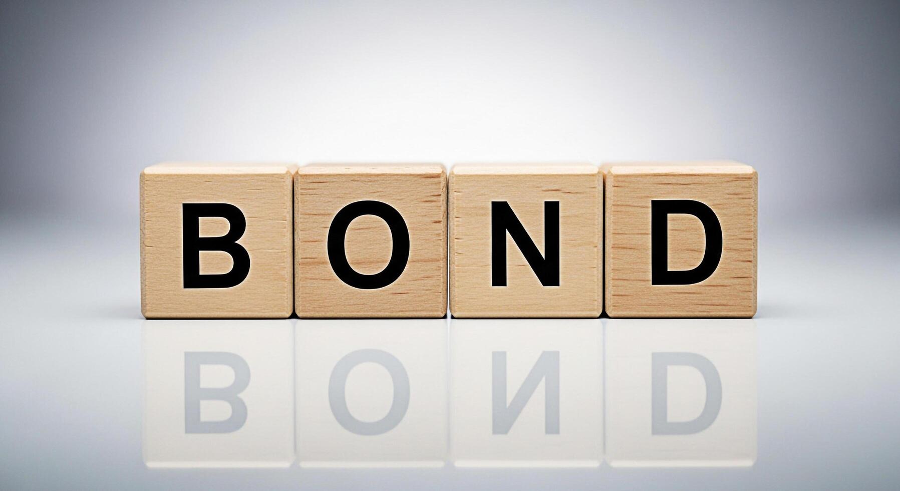Wooden blocks spelling BOND on a reflective surface symbolizing connection and security in a financial or personal context set against a clean minimalist background conveying trust and stability photo