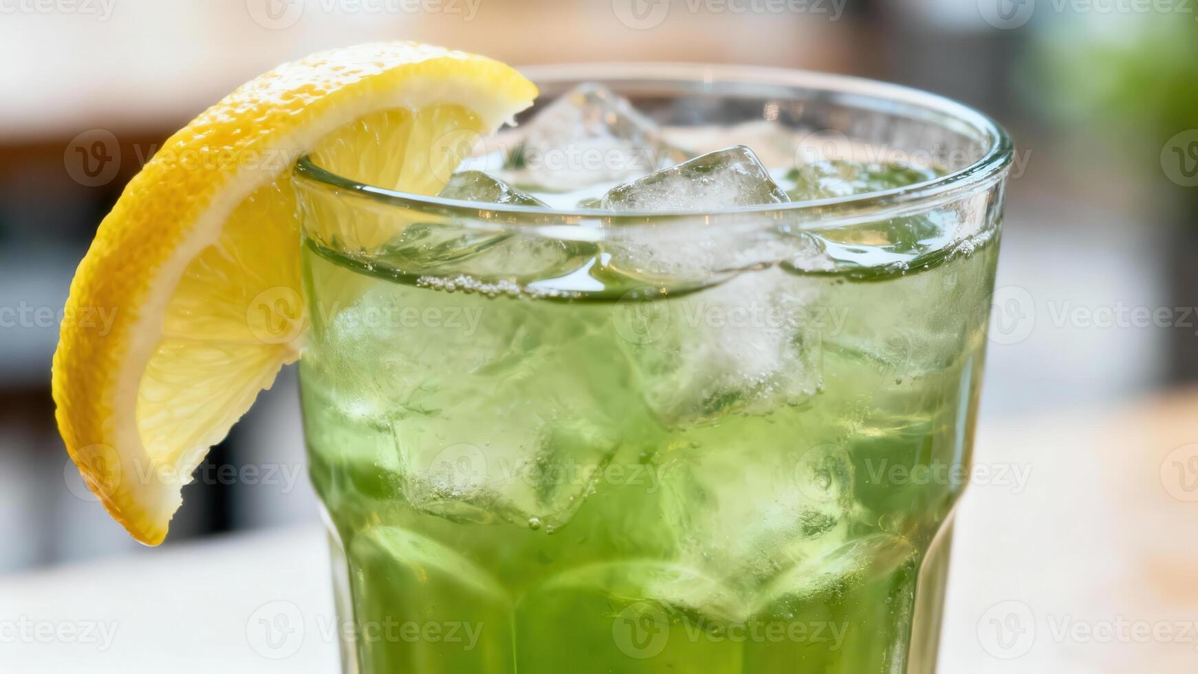 Refreshing iced beverage with a bright citrus slice presented in a clear drinking container photo