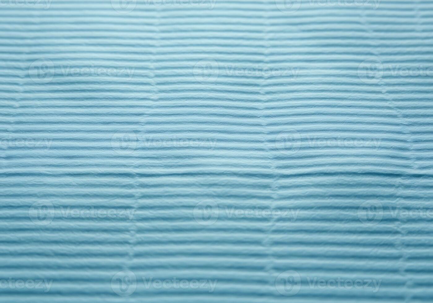 A soothing light blue textured background with subtle horizontal linear patterns creating a serene and versatile design element photo