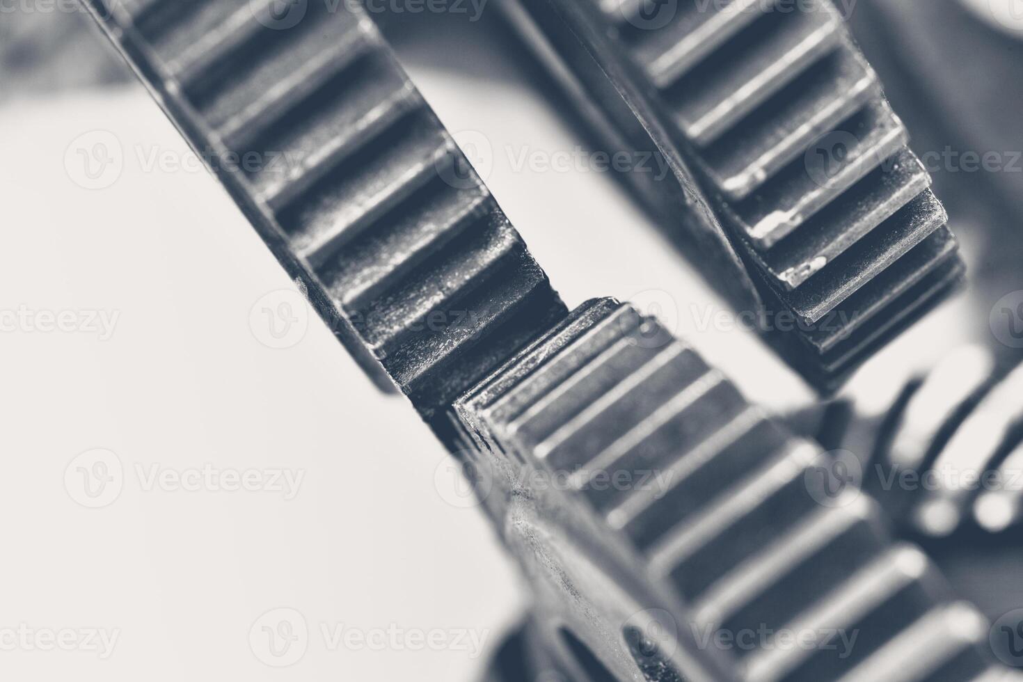 Close-up view of interlocking gears in a mechanical device showing intricate details photo