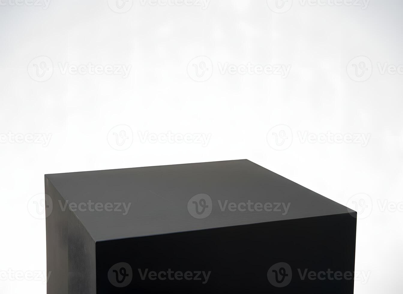 A black cube podium sits in the lower portion of the frame against a bright white background, creating a minimalist and stark composition photo