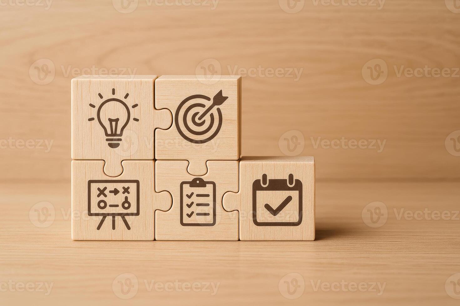 Wooden puzzle blocks with icons of light bulb, target, strategy board, checklist, and calendar symbolizing leadership team management concepts in warm wooden background setting photo