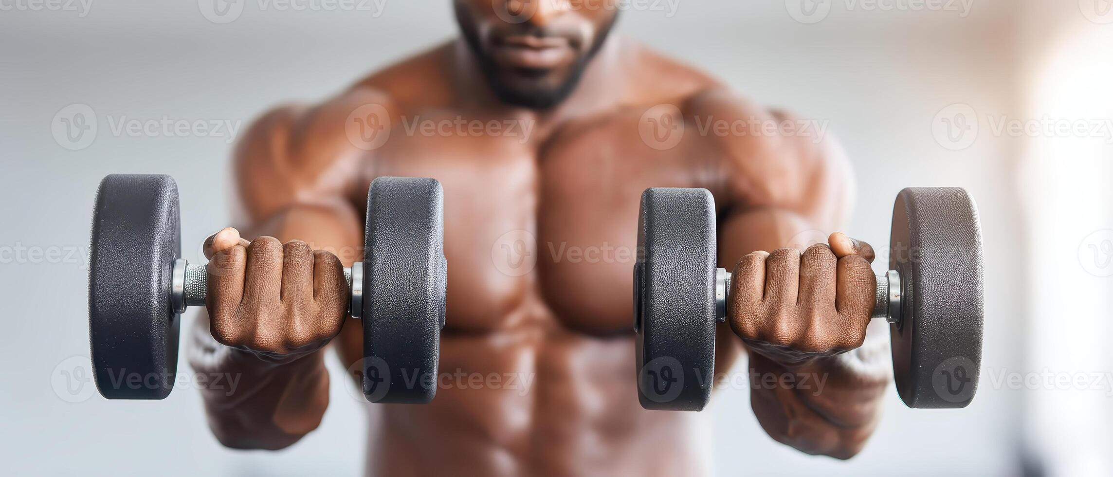 Strong gym enthusiast engages in focused workout with dumbbells, showcasing dedication to fitness and wellness through intense exercise and routines photo