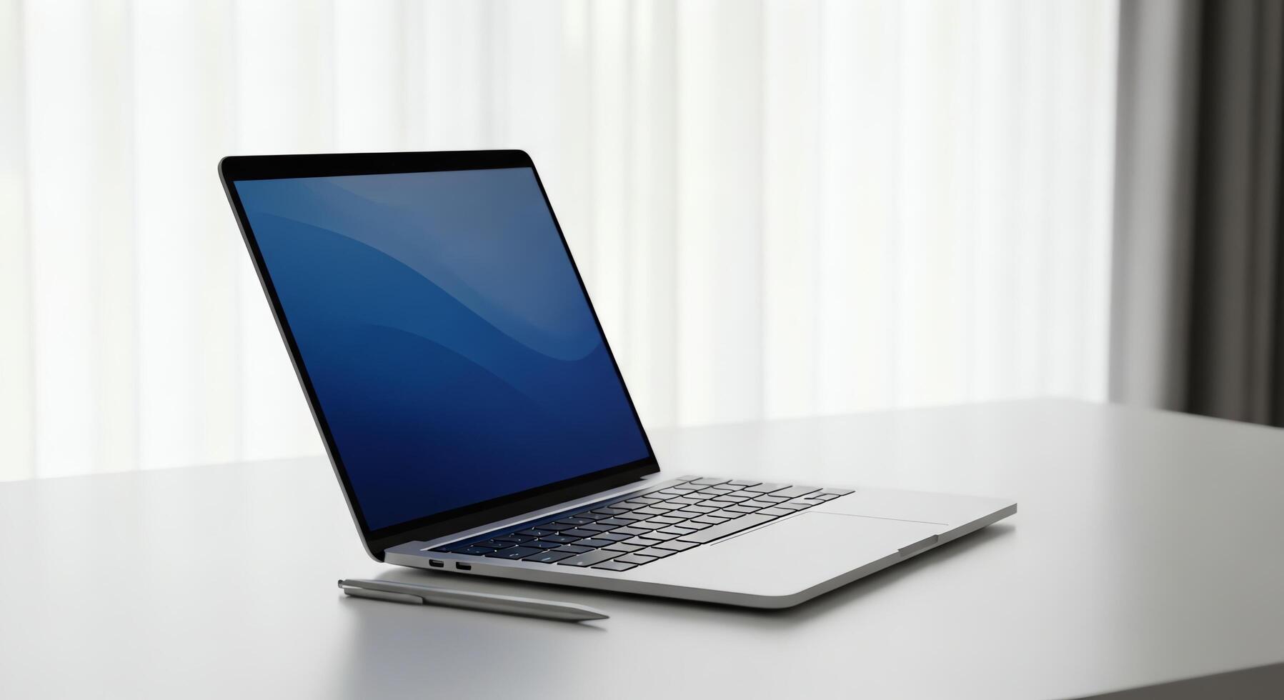 Modern portable computer open on a white desk with a pen, clean office background photo