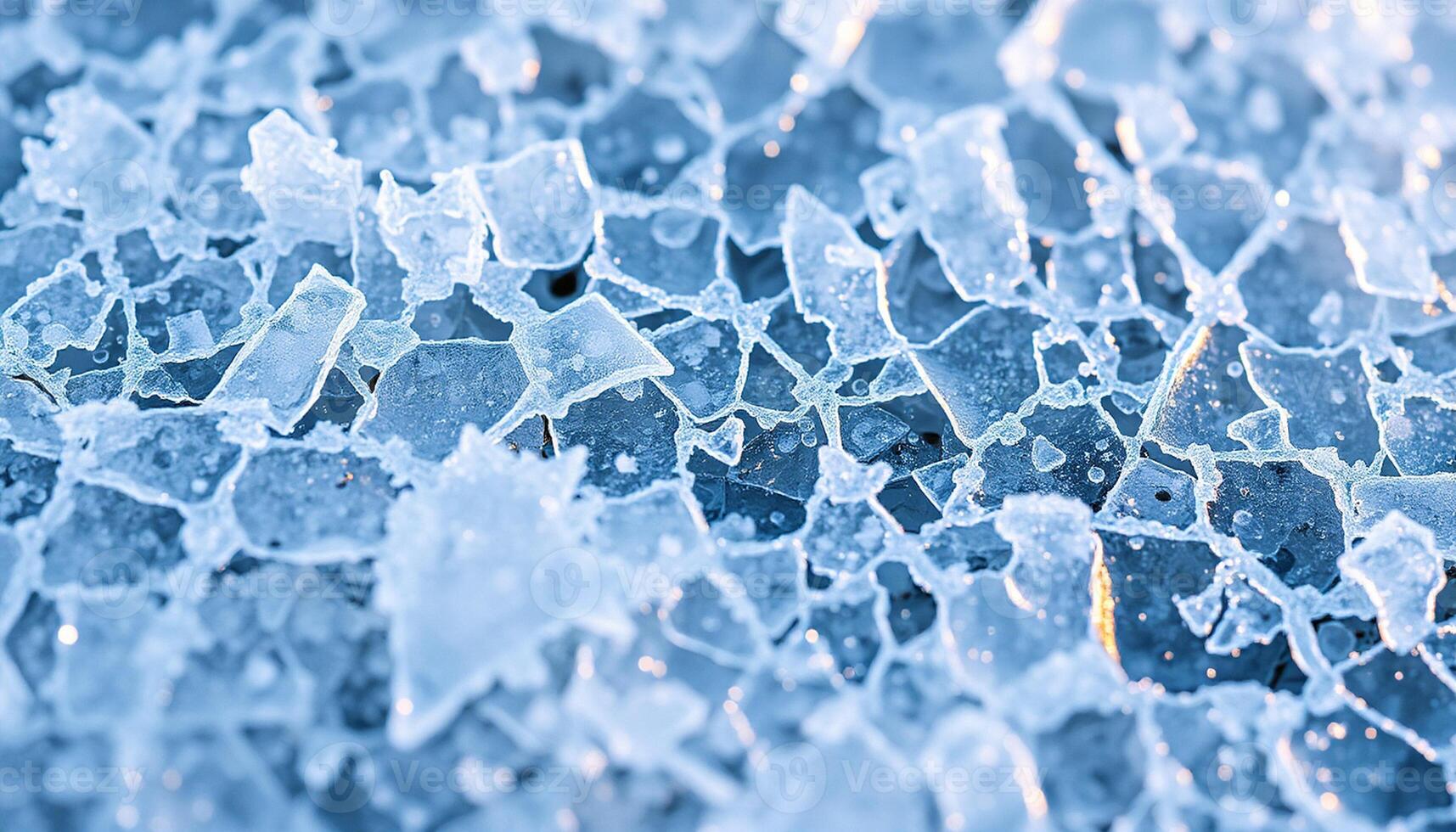 Blue toned background texture showing a complex system of intersecting cracks and frozen air bubbles photo