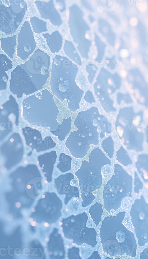 Macro view of a deeply fractured ice surface showing intricate crack patterns and crystalline shards photo