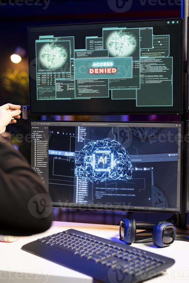 Hacker inserts USB drive to steal data, system responds with access denied warning on screen. Cybercriminal having cyber attacks rejected, malware AI software uploading on computer failing photo