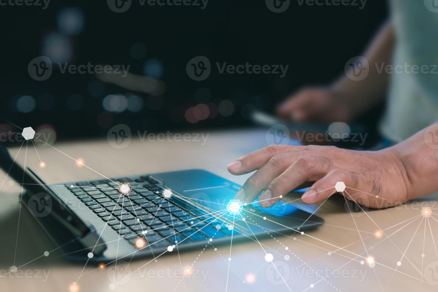Close-up, Digital technology information network concept. Using a laptop to connect to the internet. A man using laptop play social media to search for information. Black background with bokeh. photo