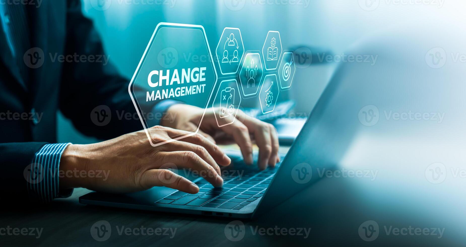 Change management concept with businessman using laptop and virtual interface icons representing leadership, teamwork, strategy, and learning for organizational transformation and business improvement photo