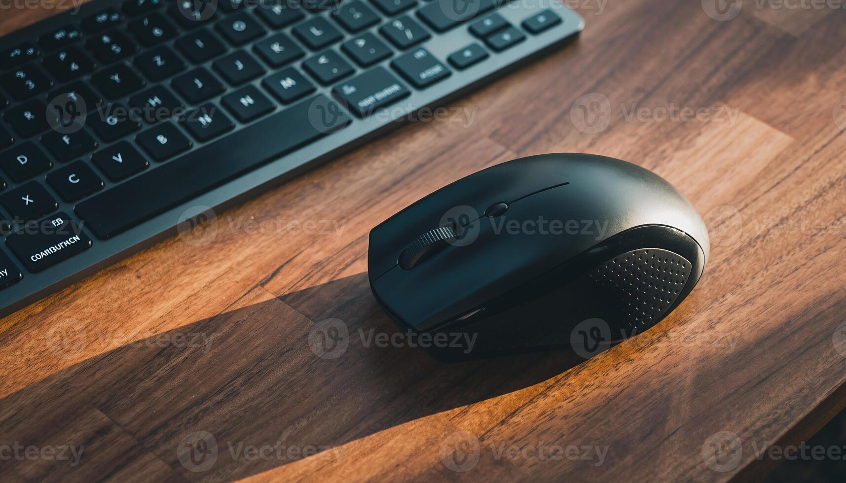 Computer Keyboard and Wireless Mouse on Wooden Desk in Office Setting photo