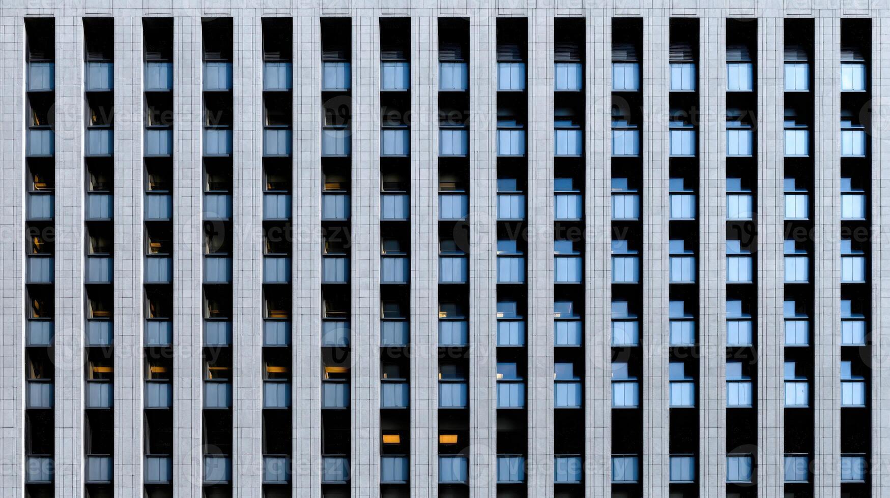 Modern architecture with vertical lines and glass in an urban setting photo