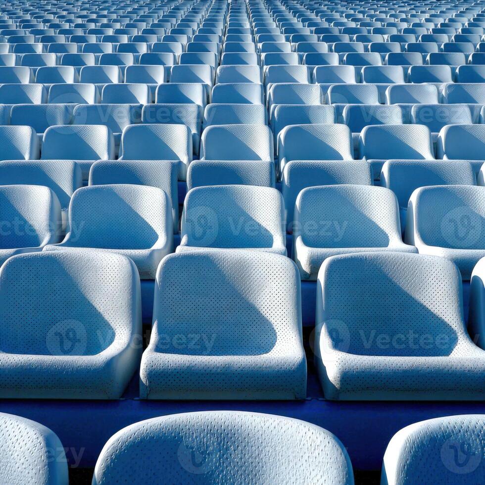 Empty stadium seats arranged in neat rows under bright sunlight photo