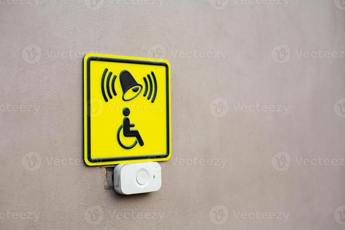 Concept photo on accessibility for people with disabilities with space for text. Project about people with injuries and physical disabilities. Wall with help button and symbol of person in wheelchair