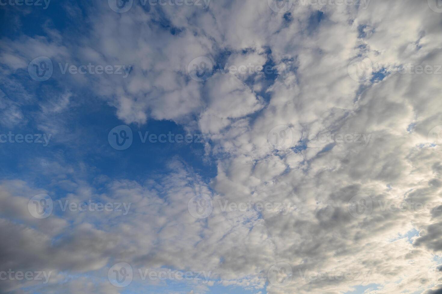 A Beautiful and Calming Cloudy Sky Filled with Striking Blue Patches Creating a Mesmerizing View photo
