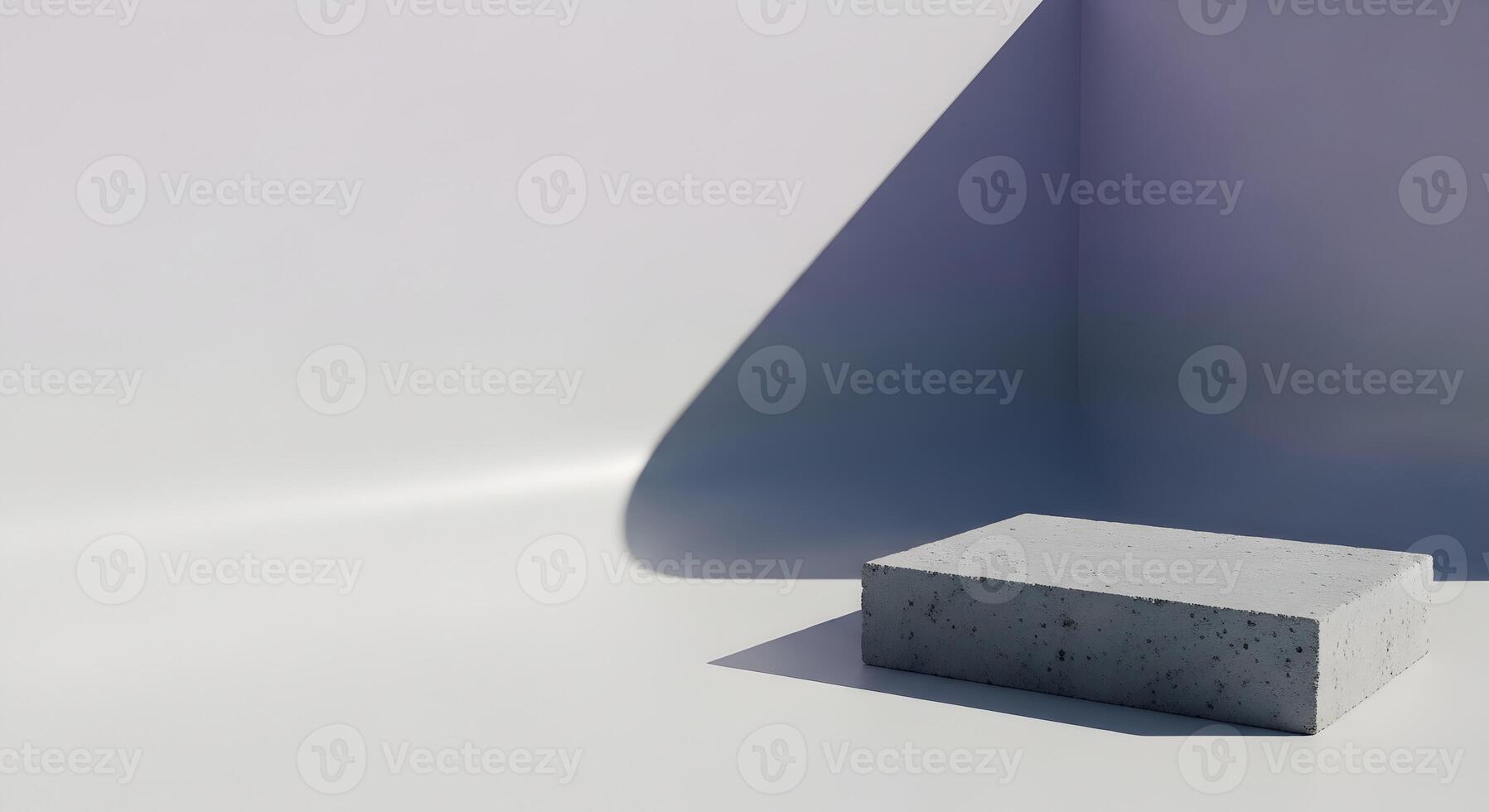 Minimalist concrete block presentation on white surface with corner shadows and modern geometric composition photo