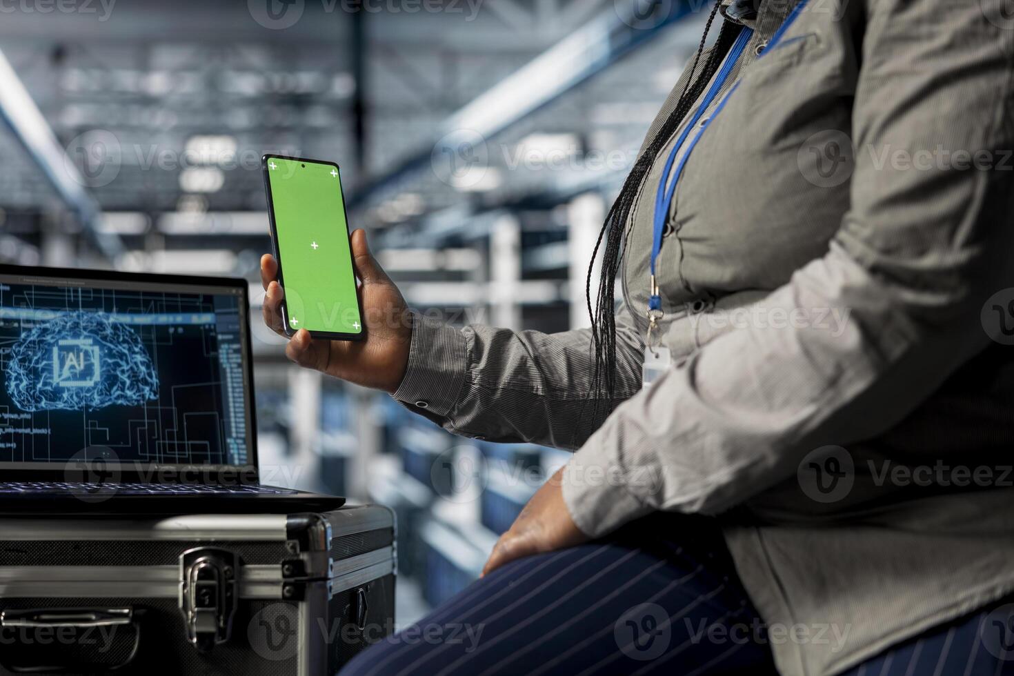 Close up of AI data center admin using green screen smartphone to check messages while taking break. Server hub IT specialist scrolling through social media during downtime at work using mockup phone photo