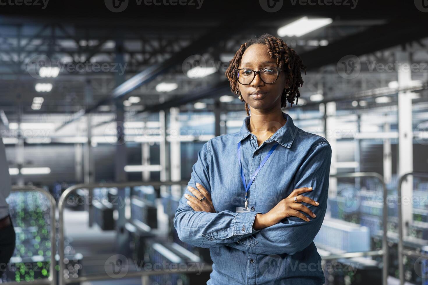 Portrait of smiling african american engineer running diagnostics on AI tools, using deep learning equipment to identify errors. Happy woman working to prevent failure and minimize downtime. photo