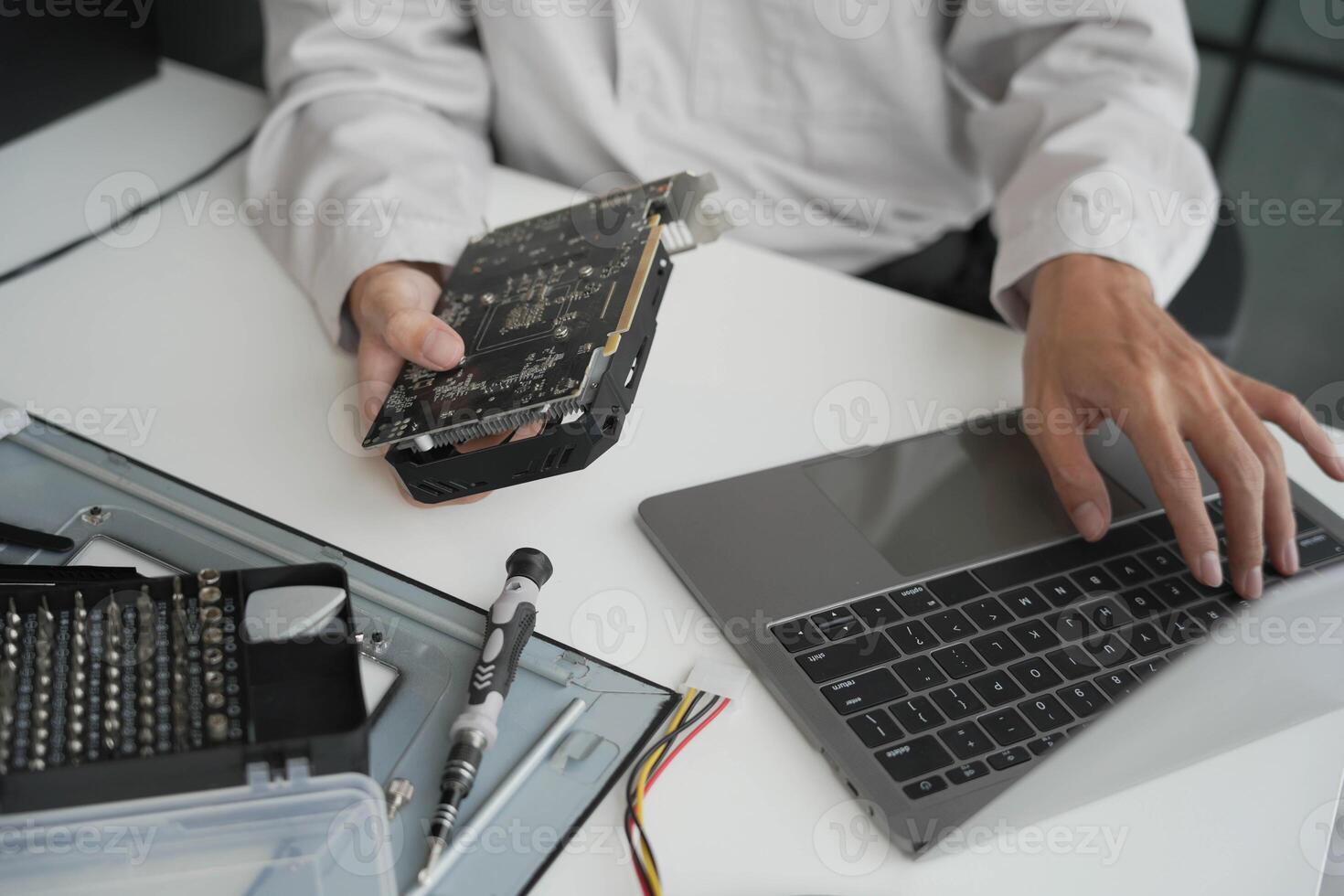 Hand of Computer Hardware dissemblers fixing computer PC. photo