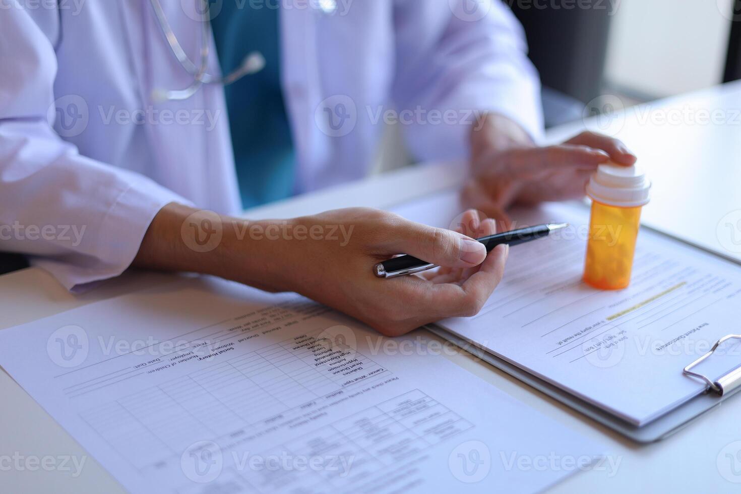 Doctor or General practitioner explain to patient how to use prescribed medicine correctly by explain dosage, frequency, and timing photo
