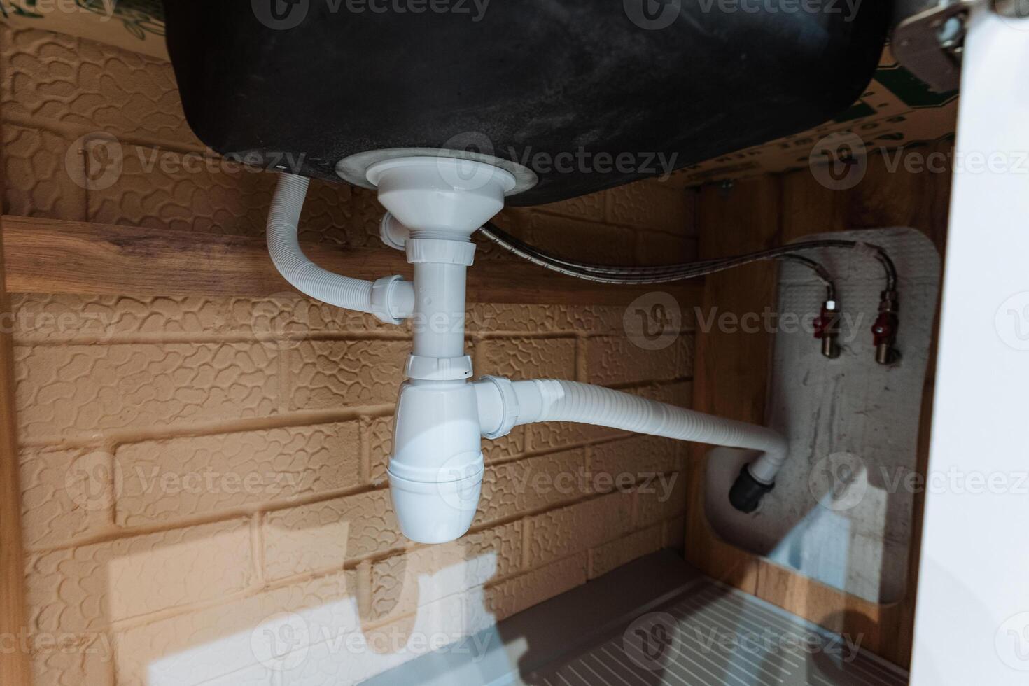 clear controls and accessible piping, accessible plumbing fittings and visible shutoff valves for convenience, userfriendly pipe configuration with exposed components and easy controls photo