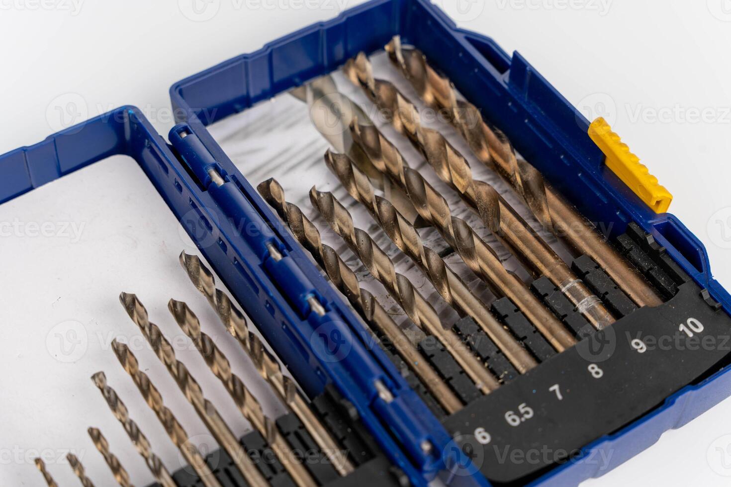 High-quality drill bit set in a blue case, featuring various sizes and shapes, showcasing precision engineering and essential tools for woodworking and metalworking projects photo