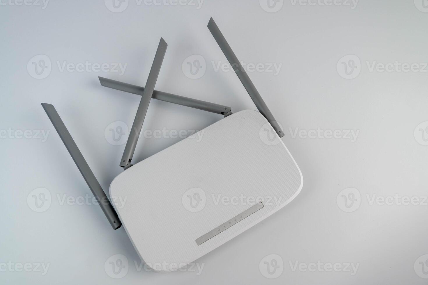 Wireless router with extended antennas positioned on a clean surface, showcasing modern technology and connectivity features for home and office environments photo