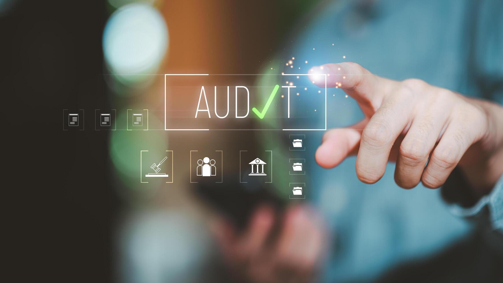 Close-up of hand touching digital screen with audit text, checkmark icon, and virtual interface representing data verification, compliance process, and financial business technology concept. photo
