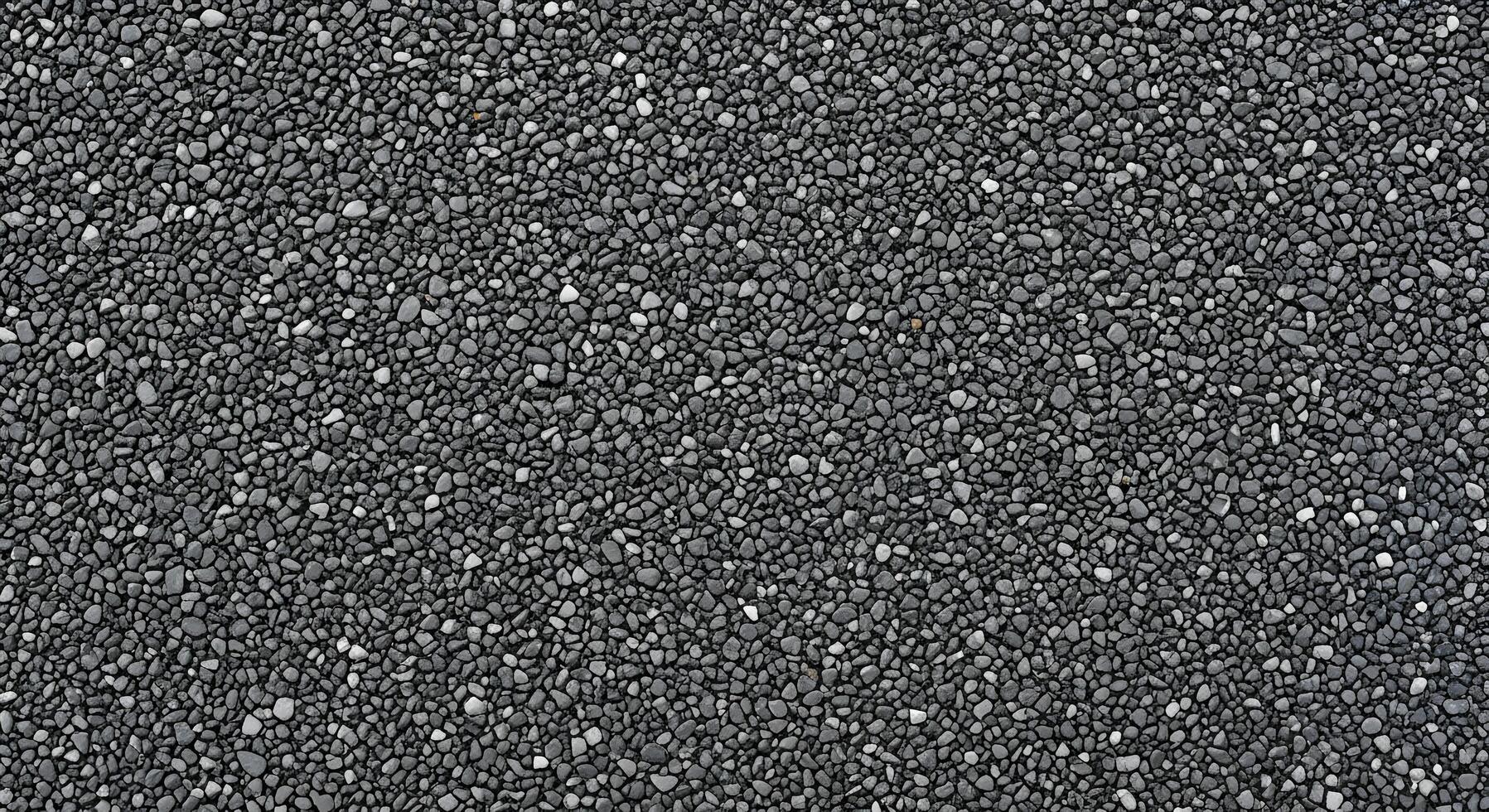 Seamless dark grey pebble texture background, showcasing a uniform pattern of small, natural aggregate. Ideal for abstract backdrops and architectural design elements photo