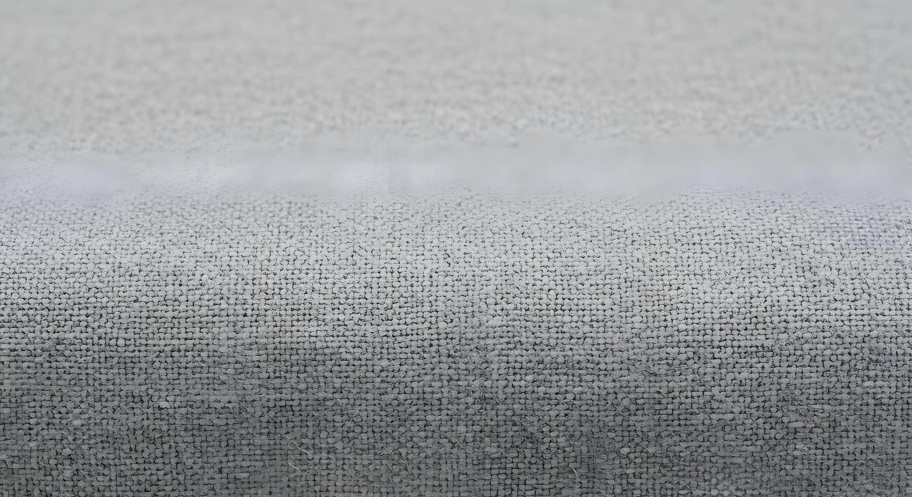 Close-up of a light grey fabric texture, revealing soft woven loops and a subtle gradient. A versatile background for modern design, interior decor, and material-focused projects photo