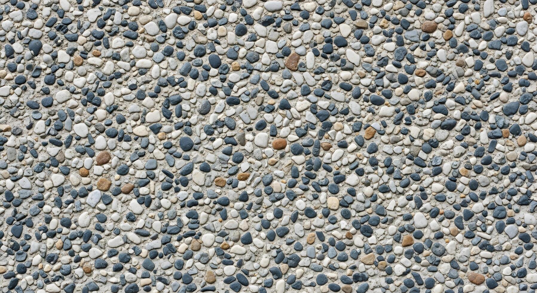 Close-up of a resilient exposed aggregate surface, highlighting the intricate natural texture created by numerous small, multi-toned pebbles, perfect for modern design elements photo