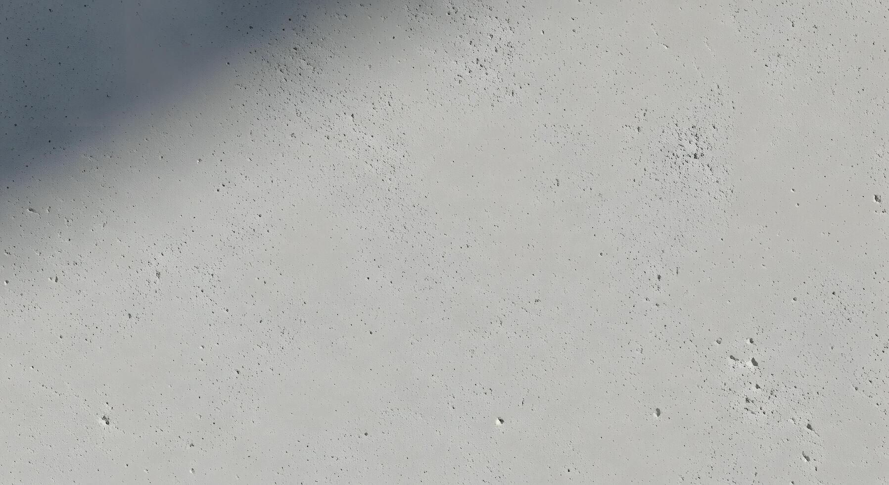 Minimalist textured grey concrete surface with subtle natural imperfections and gentle shadows creating a versatile abstract background for modern design and architectural concepts photo