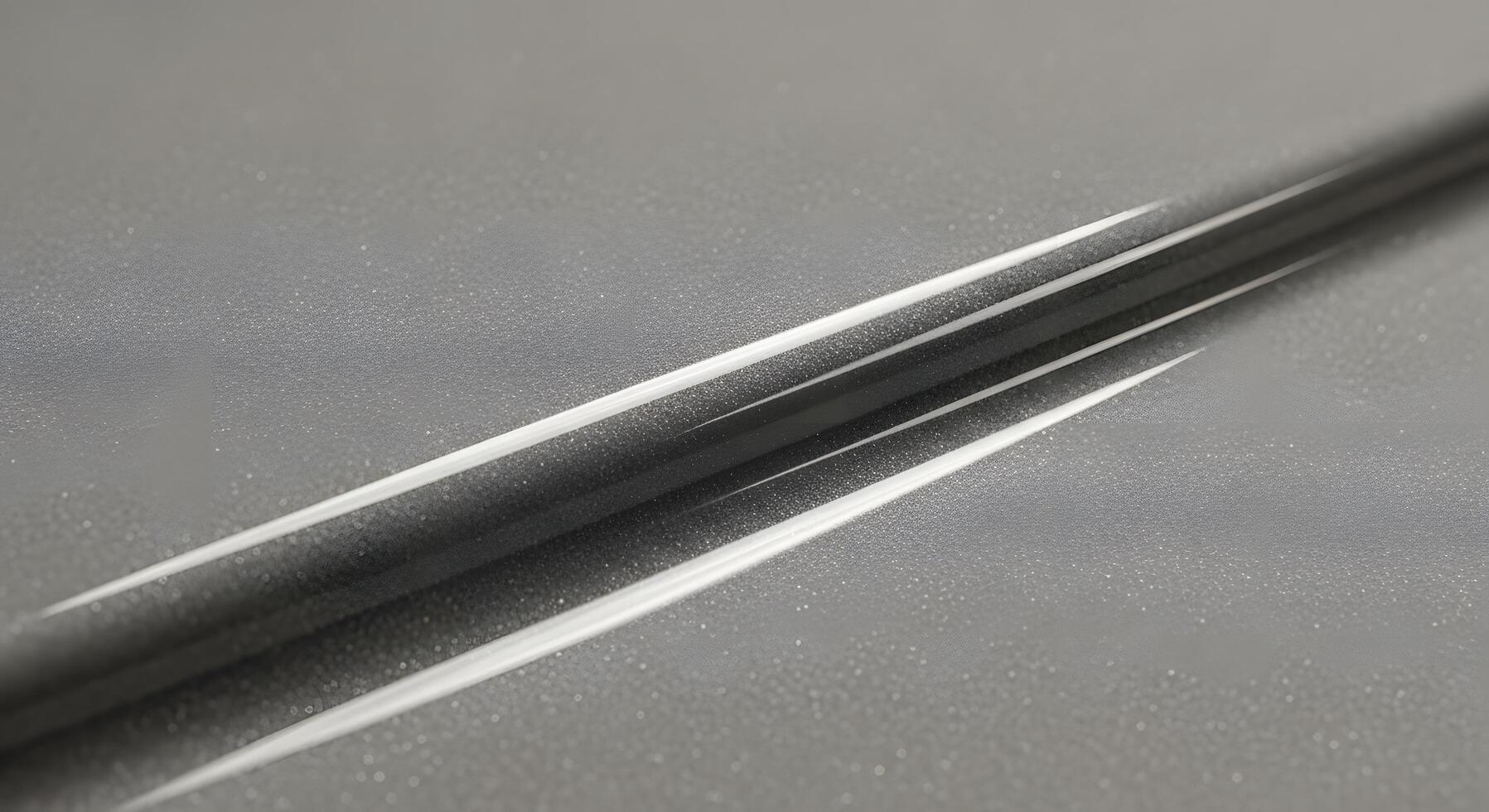 Dynamic abstract pattern featuring sleek, parallel white lines cutting through a subtly textured grey surface, creating a modern and futuristic visual with strong contrast and geometric precision photo