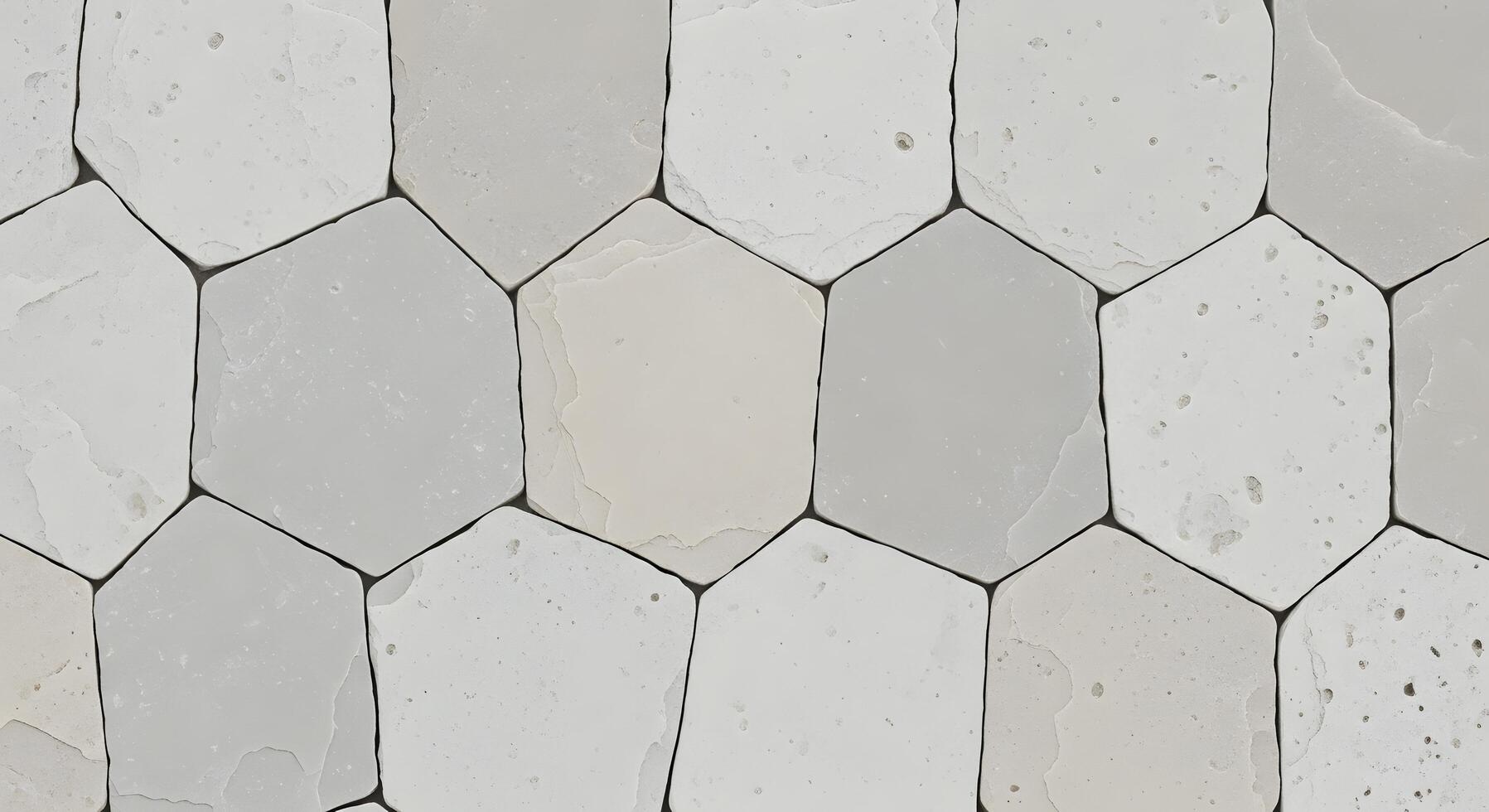 Abstract background of irregular light grey and white hexagonal stone tiles, creating a geometric pattern with natural texture and subtle variations, perfect for modern design concepts photo