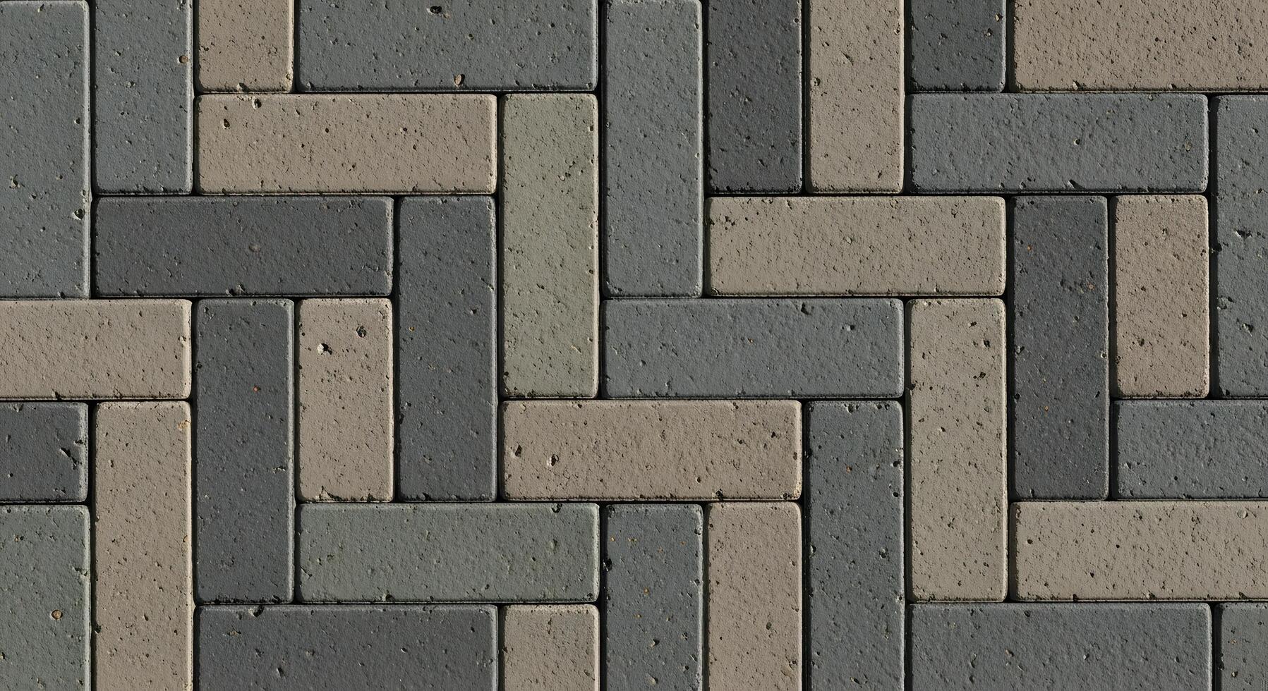 Seamless pattern of interlocking grey and beige rectangular paving stones creating a durable textured surface, ideal for modern architectural backgrounds and urban designs photo