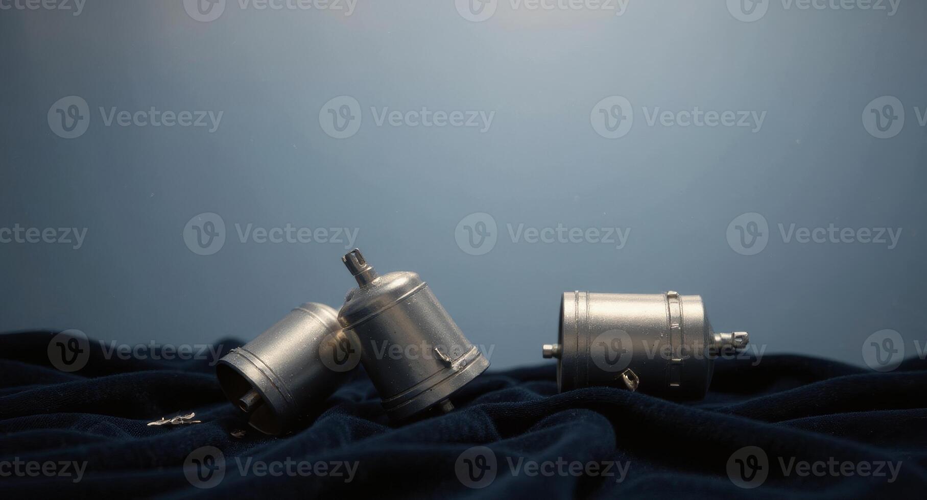 Intriguing metal parts resting on soft fabric, perfect for industrial design concepts, engineering projects, or artistic explorations of mechanics and form photo