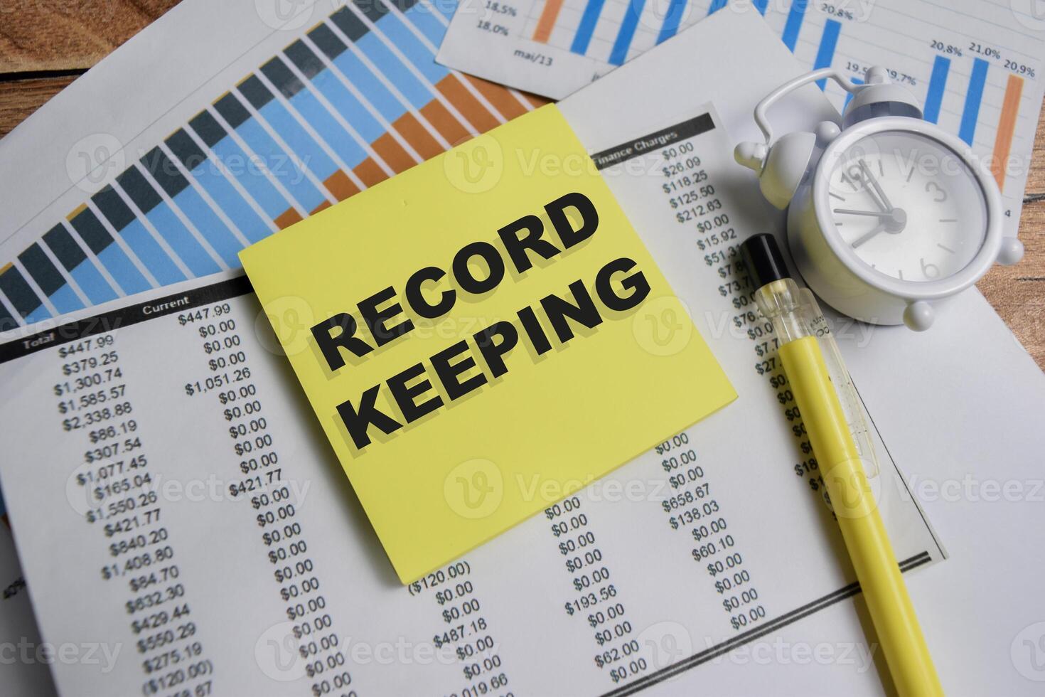 Concept of record keeping write on sticky notes isolated on Wooden Table. photo