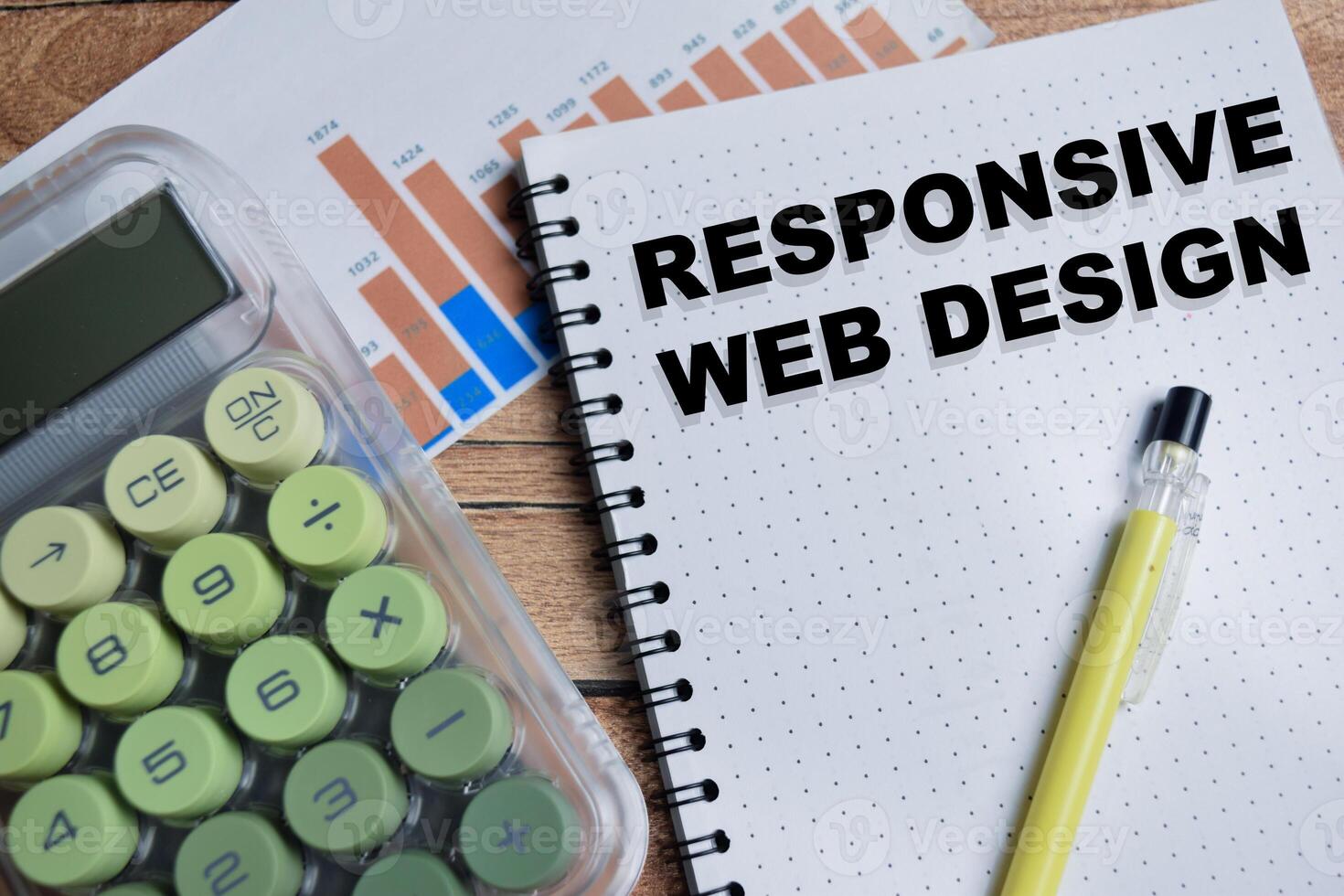 Concept of responsive web design write on book isolated on Wooden Table. photo