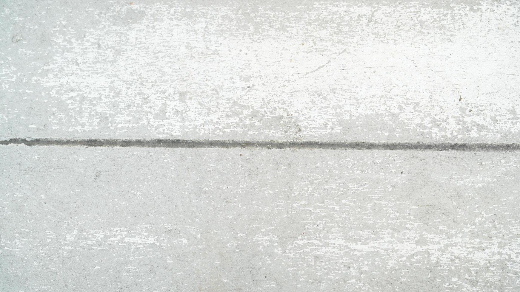 Smooth Gray Concrete Surface with Subtle Texture and Seam, Ideal for Backgrounds or Design Projects in Architecture and Industrial Themes photo