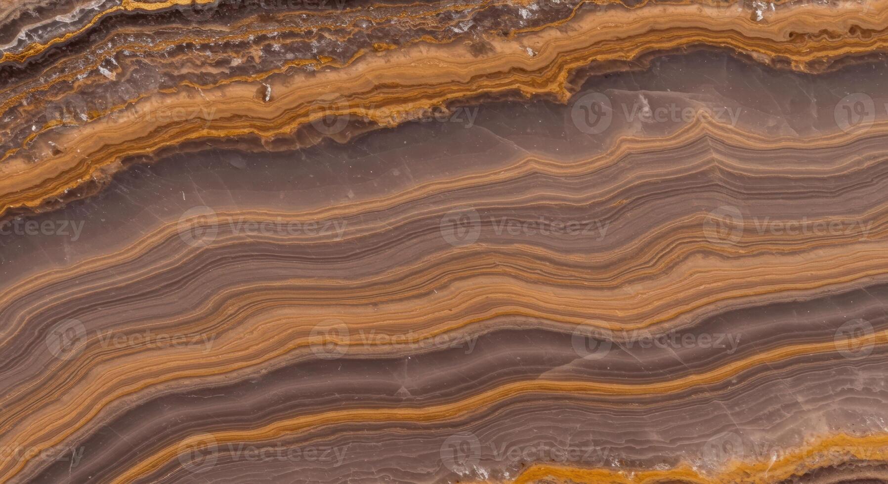 An intricate brown onyx stone displays flowing banded layers of texture and pattern, creating a stunning natural abstract background design. photo
