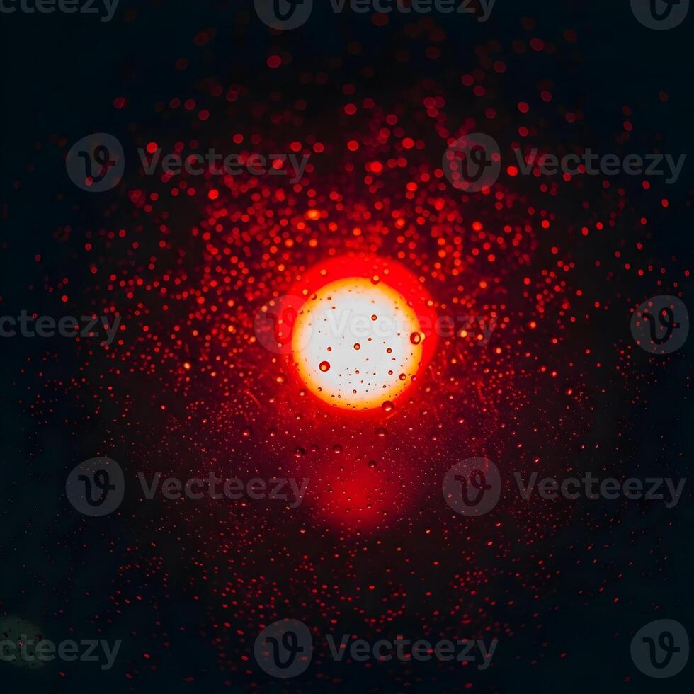Abstract Red Light with Raindrops on Glass Creating Bokeh Effect at Night Depicting Mood and Atmosphere of Mystery and Intrigue photo