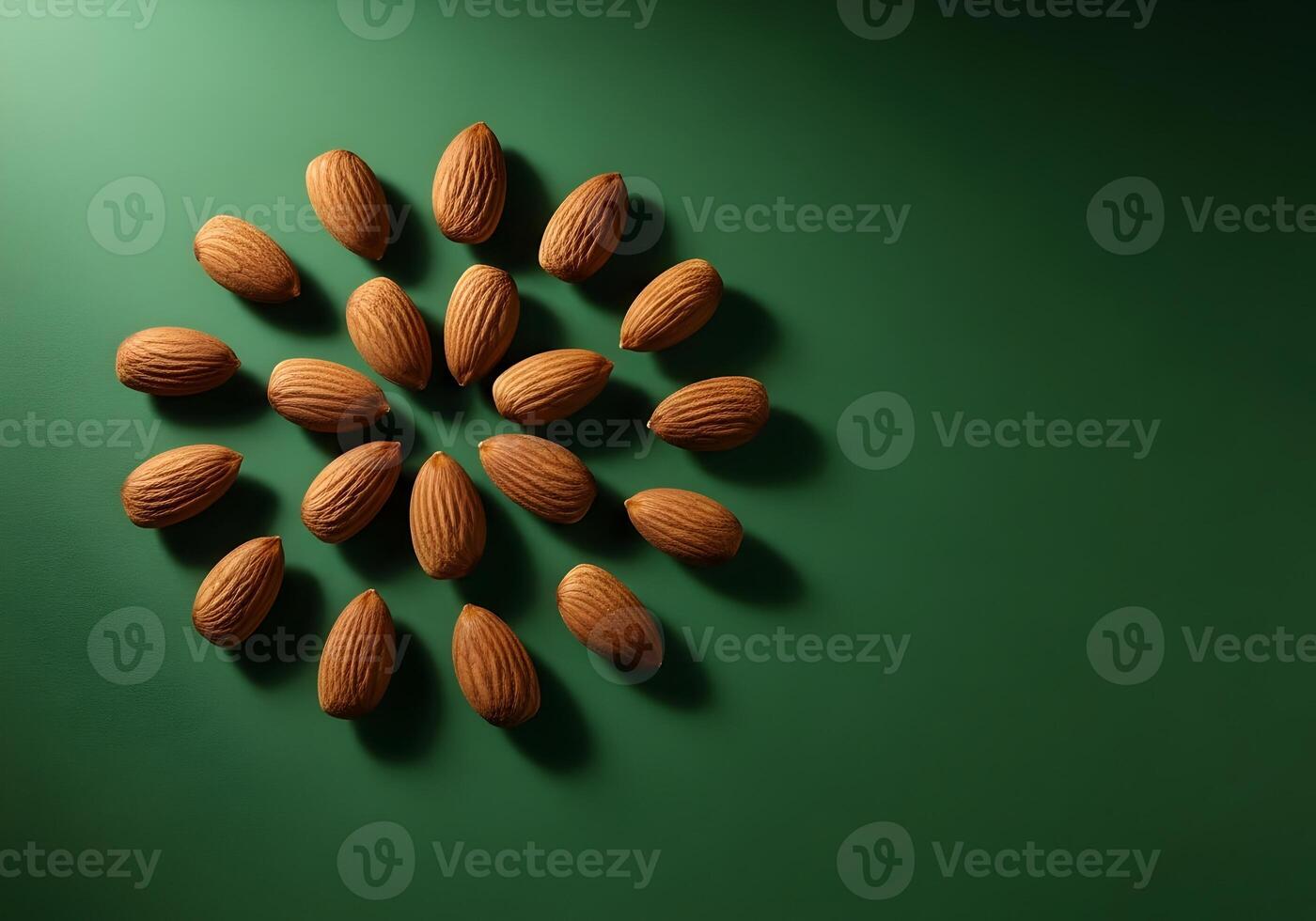Overhead View of Almonds Arranged in a Circular Pattern on a Dark Green Background with Ample Copy Space for Health and Wellness Messages photo
