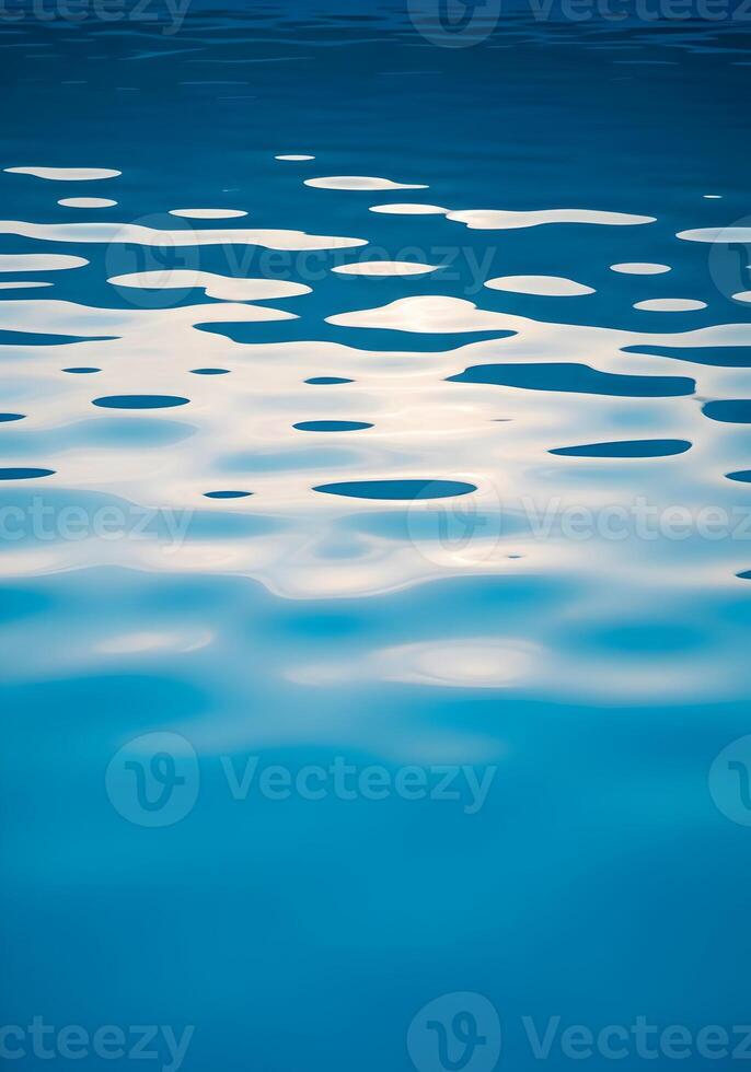 Serene Blue Water Surface Reflecting Light with Gentle Ripples Creating Abstract Patterns and Shapes for Meditative and Calming Visuals photo