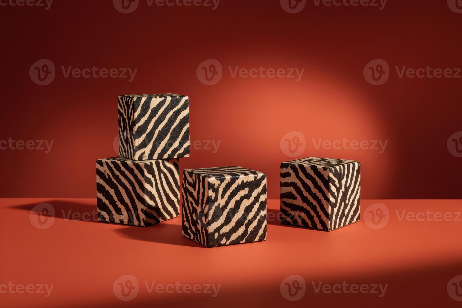 Decorative cubes with zebra print on a red background photo